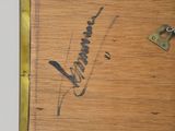 a close up of a painting with a key on it