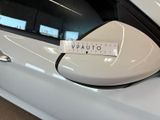 a sticker on the side mirror of a white car