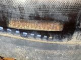 a close up of a rusted car door handle
