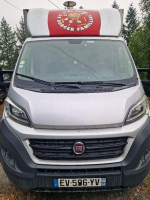 a white van that is parked in the parking lot