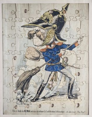 a picture of a puzzle piece with a picture of a man holding a broom