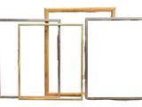 three different colored frames are arranged on a white surface
