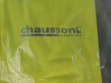a close up of a yellow bag with a logo on it