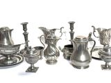 a lot of silver items that are on a table