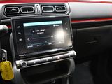 the interior of a car with a radio and a steering control