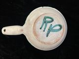 a cup of coffee with the word rip painted on it