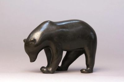 a black bear statue on a white background