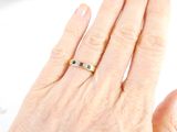 a woman ' s hand that has a ring on it