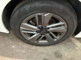 a close up of a tire on a white car