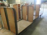a group of beds that are in a room