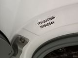 a close up of a washing machine with a label on it