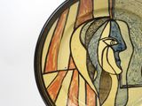 a plate with a picture of a woman on it