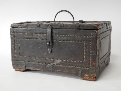 an old trunk that is sitting on a white surface