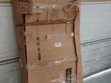 a large cardboard box sitting on top of a pile of boxes