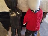 two mannequins that are standing next to each other