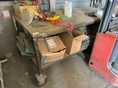 a workbench with a bunch of boxes and tools on it