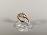 an image of a gold ring with a blue topaz stone