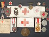 an assortment of medals, medals, and other items displayed on a table