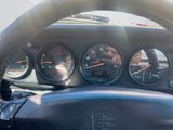 a steering wheel and gauges in a car