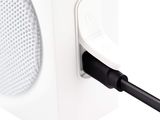 an image of a white speaker with a black cord plugged into it