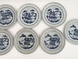 six plates with blue and white designs on them on a white surface