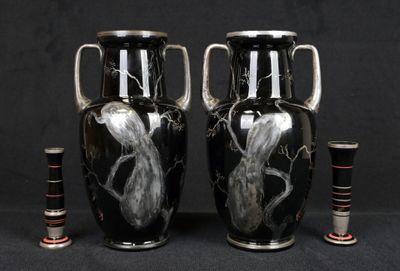 two vases that are sitting next to each other on a table