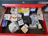 a red tool box filled with assorted items