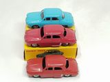 three toy cars that are sitting on top of each other
