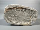 an image of a stone with a face on it