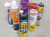 many different types of spray paint on the table