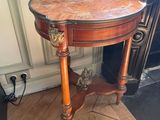 a small table with a cat sitting on top of it