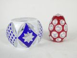 pair of red, white and blue glass vases on a white surface