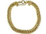 a close up of a gold chain bracelet on a white background