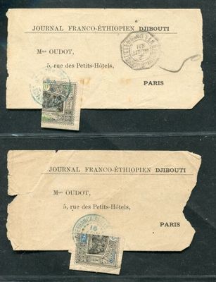two pieces of paper with stamps on them sitting on top of a table
