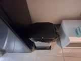 a person standing in front of a suitcase on the floor