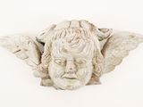 a statue of an angel with wings on it ' s head