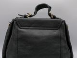 a black leather handbag on a white background
