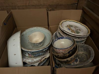 a box full of plates and bowls in it