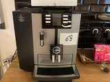a coffee machine sitting on a counter in a kitchen