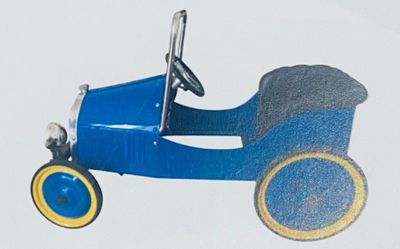 a blue toy car that is sitting on a white surface