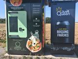 two vending machines on the side of the road