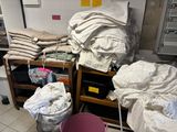 a room with a bunch of bags and a chair