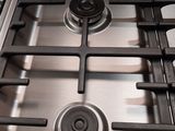 a close up of a gas stove in a kitchen