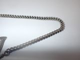 a silver chain with a bird charm on it