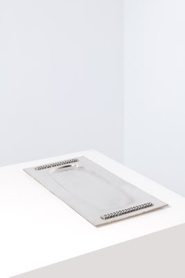 an image of a white table with a plate on top of it