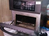 a toaster oven sitting on top of a counter in a kitchen