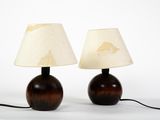 pair of wooden table lamps with lampshads on top of them