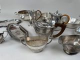 a lot of silver items that are on the table