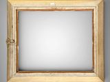 a close up of a mirror on a wall with a wooden frame