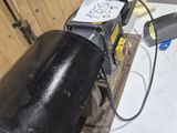 an image of a black pipe with a sign on it